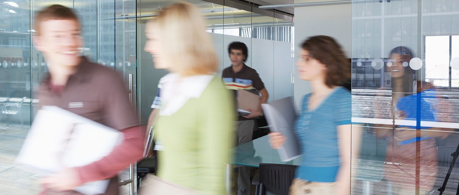 People leaving meeting room.
