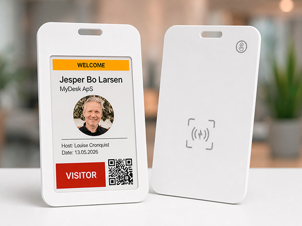 Visitor ID badge showing name Jesper Bo Larsen for MyDesk ApS, host Louise Cronquist, date 13.05.2026, with photo, QR code and red VISITOR button